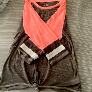 It is a pink gray and white Long sleeve shirt